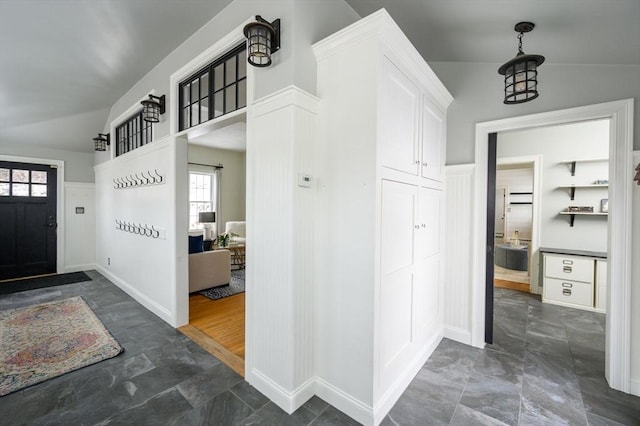 mudroom featuring vaulted ceiling