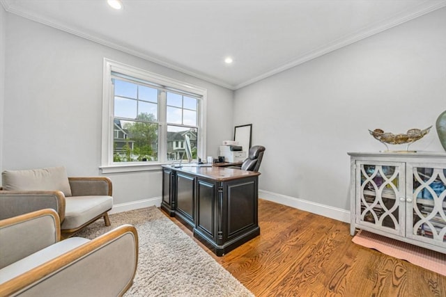 office featuring light wood finished floors, baseboards, ornamental molding, and recessed lighting