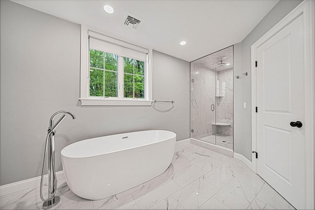 full bathroom featuring marble finish floor, a marble finish shower, recessed lighting, a soaking tub, and baseboards