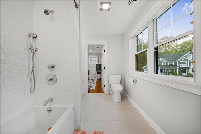 full bath with toilet, shower / bath combination, baseboards, and tile patterned floors
