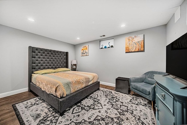 bedroom with recessed lighting, baseboards, visible vents, and wood finished floors