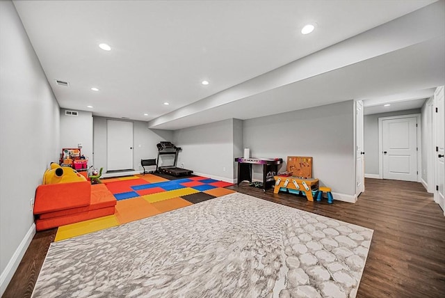 rec room featuring baseboards, visible vents, recessed lighting, and wood finished floors