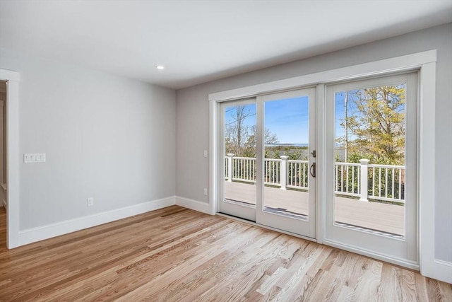 entryway featuring recessed lighting, baseboards, and light wood finished floors