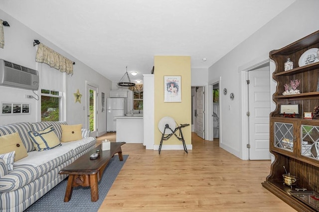 3 Chipmunk Trl Unit 3, Westford, MA 01886 - living room with a wall mounted AC, light wood-style floors, and baseboards