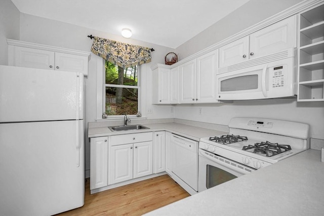 3 Chipmunk Trl Unit 3, Westford, MA 01886 - kitchen featuring white appliances, a sink, light countertops, white cabinetry, and light wood-style flooring