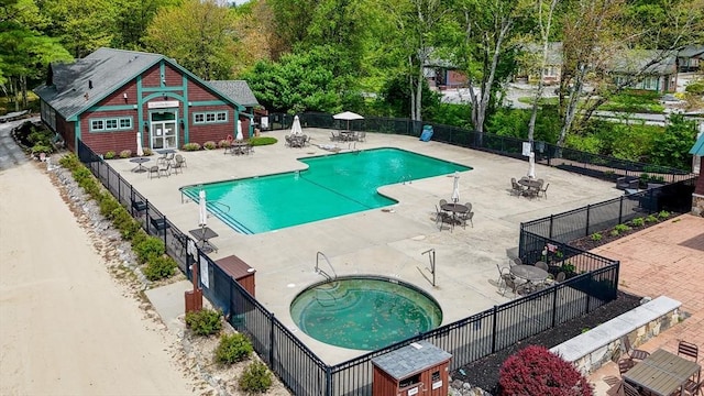 3 Chipmunk Trl Unit 3, Westford, MA 01886 - community pool featuring a patio, an outdoor structure, and a hot tub