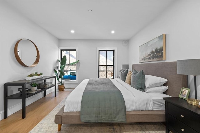 bedroom featuring recessed lighting and light wood finished floors