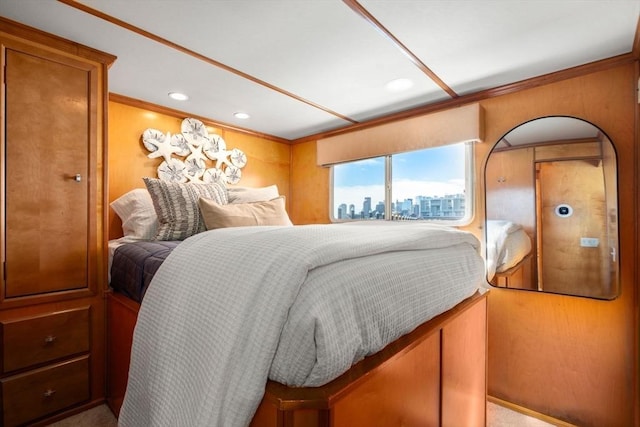 bedroom featuring recessed lighting, a view of city, and ornamental molding