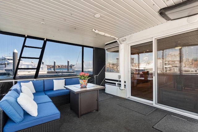 sunroom / solarium with wood ceiling and a view of city