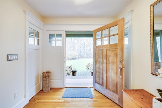 foyer featuring light wood finished floors