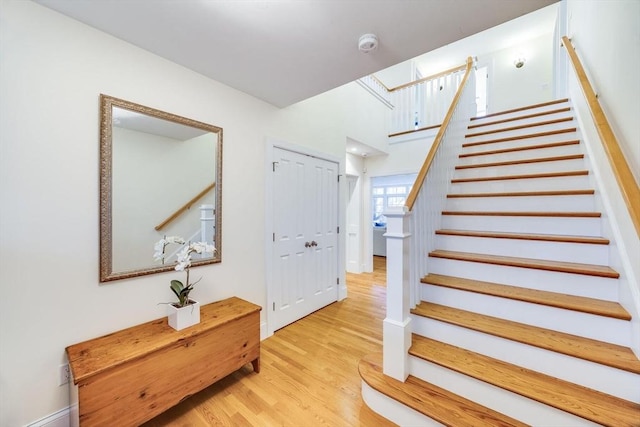 staircase with wood finished floors