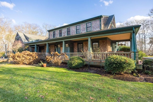 view of front of home with a front lawn and a porch