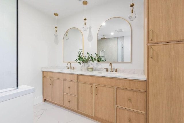 full bath with marble look tiles, double vanity, and a shower