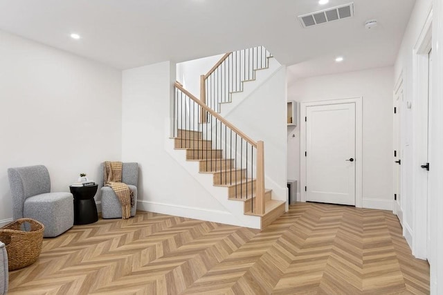 staircase featuring recessed lighting and baseboards