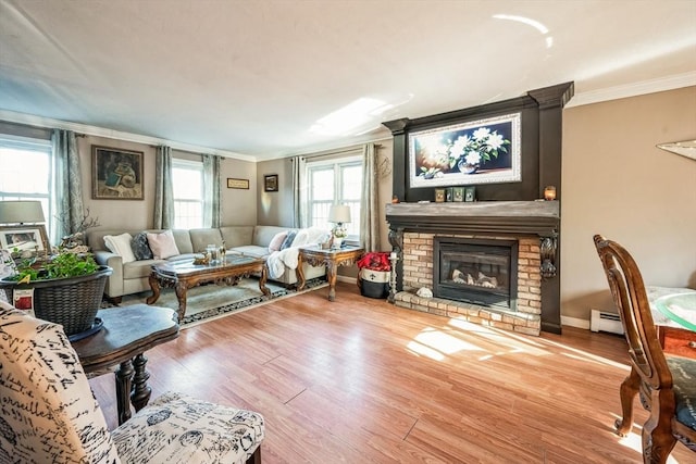 375 Winchendon Rd, Ashburnham, MA 01430 - living room featuring ornamental molding, wood finished floors, a brick fireplace, and baseboard heating