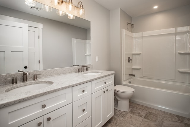 full bathroom with vanity, toilet, and washtub / shower combination