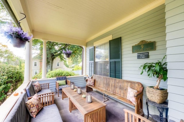 view of patio / terrace with a porch and an outdoor living space