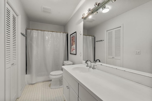 51 Pettee St Unit 36, Newton, MA 02464 - bathroom with a closet, vanity, toilet, tile patterned flooring, and a shower with shower curtain