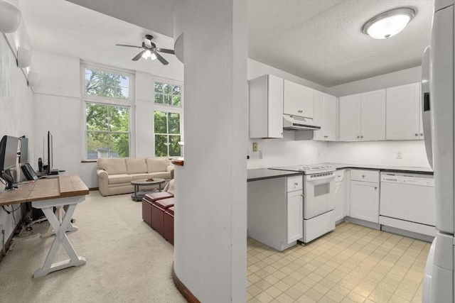 51 Pettee St Unit 36, Newton, MA 02464 - kitchen with white appliances, under cabinet range hood, a ceiling fan, white cabinets, and open floor plan