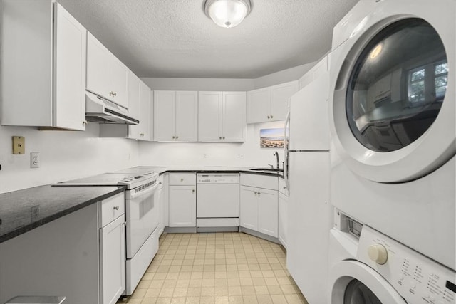 51 Pettee St Unit 36, Newton, MA 02464 - kitchen featuring white appliances, under cabinet range hood, stacked washer / dryer, a sink, and a textured ceiling