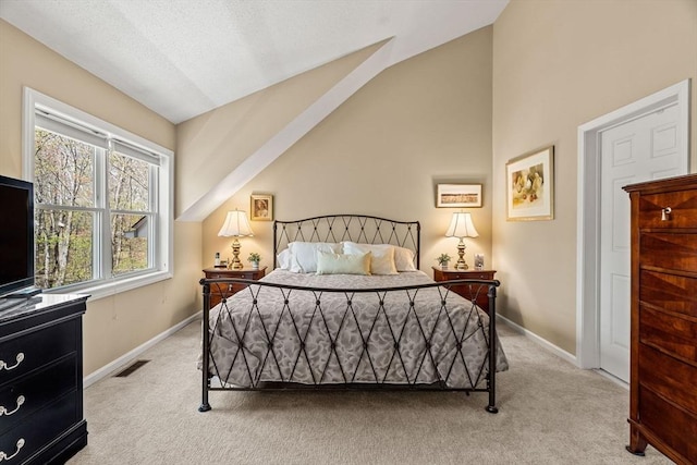 bedroom featuring baseboards, carpet flooring, lofted ceiling, and visible vents