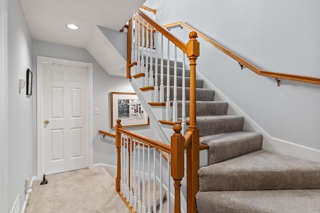 stairs with baseboards, carpet, and recessed lighting