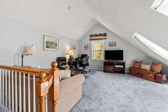 carpeted office with lofted ceiling with skylight