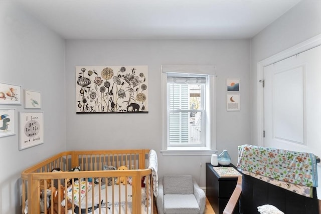 bedroom with a nursery area