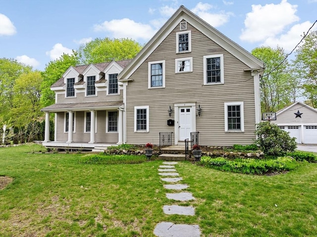 5 Liberty Rd, Hingham, MA 02043 - view of front of home featuring a front lawn, an outbuilding, a porch, and a detached garage