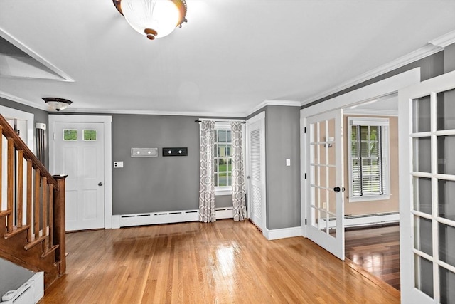 5 Liberty Rd, Hingham, MA 02043 - entryway featuring wood finished floors, crown molding, stairs, french doors, and a baseboard heating unit