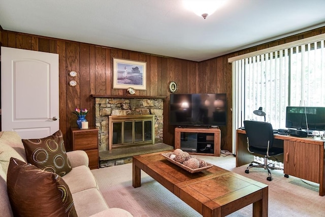 38 Stagecoach Dr, Ashland, MA 01721 - carpeted living room featuring a desk, wood walls, and a fireplace
