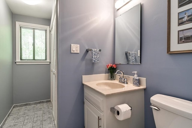 38 Stagecoach Dr, Ashland, MA 01721 - bathroom featuring toilet, vanity, and baseboards