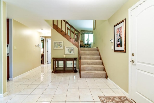 38 Stagecoach Dr, Ashland, MA 01721 - entrance foyer featuring stairs and light tile patterned floors