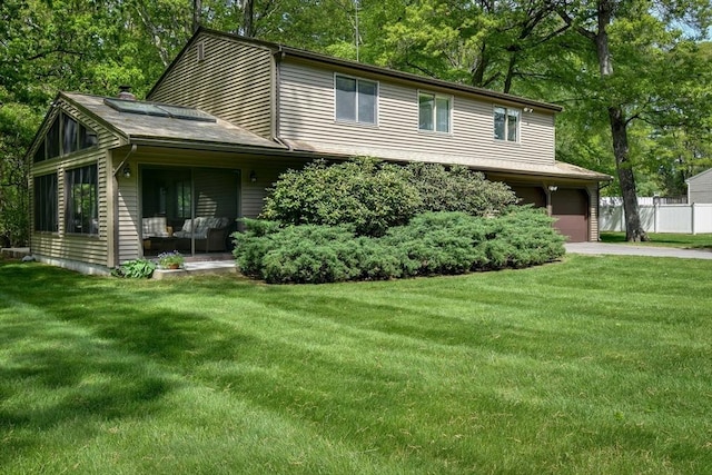 38 Stagecoach Dr, Ashland, MA 01721 - view of front of home with an attached garage, driveway, and view of wooded area