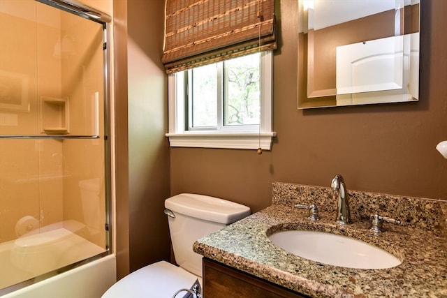 38 Stagecoach Dr, Ashland, MA 01721 - bathroom featuring toilet, vanity, and bath / shower combo with glass door