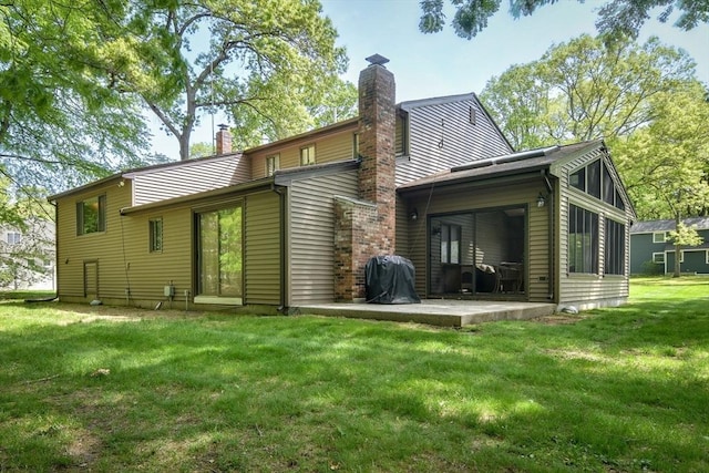 38 Stagecoach Dr, Ashland, MA 01721 - back of house featuring a chimney, a patio area, a yard, and a sunroom