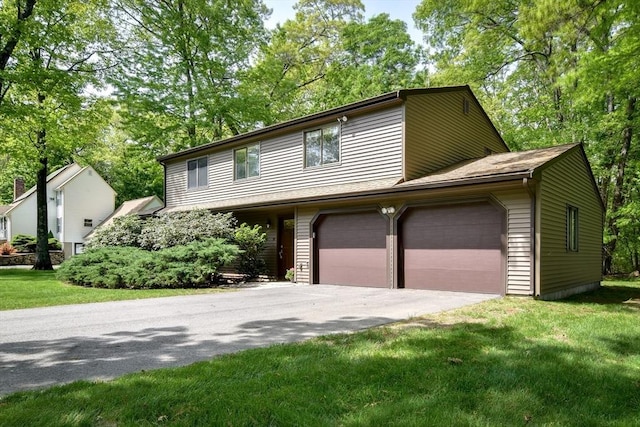 38 Stagecoach Dr, Ashland, MA 01721 - view of front of home featuring a front yard, driveway, and a garage