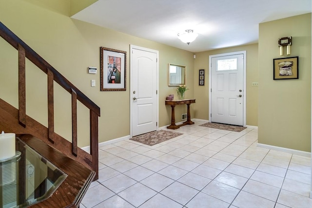 38 Stagecoach Dr, Ashland, MA 01721 - foyer featuring baseboards, light tile patterned flooring, and stairs