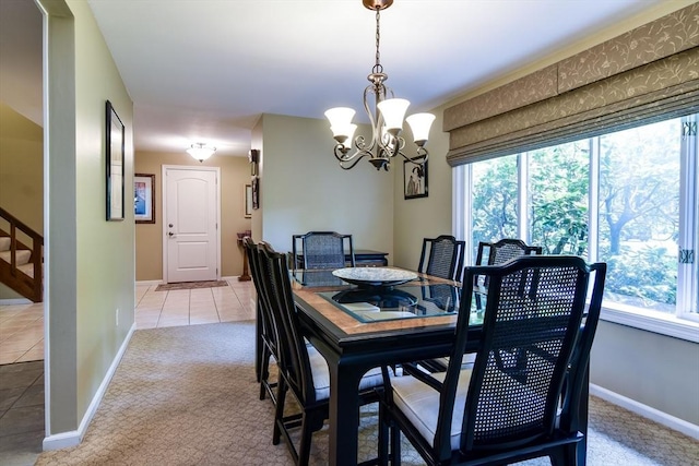 38 Stagecoach Dr, Ashland, MA 01721 - dining space featuring a chandelier, healthy amount of natural light, light tile patterned floors, and light colored carpet