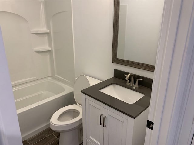 full bathroom with vanity, shower / bathtub combination, and toilet