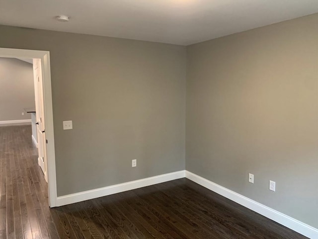 empty room featuring dark hardwood / wood-style floors