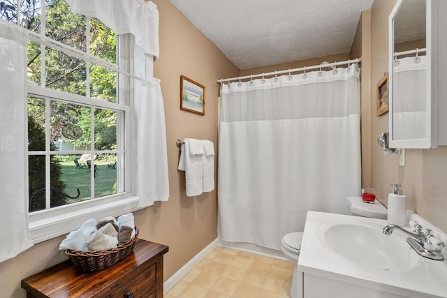 full bathroom featuring curtained shower, baseboards, toilet, tile patterned floors, and vanity