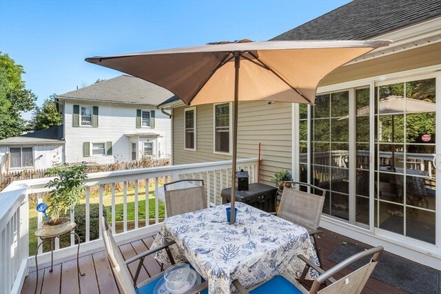 deck featuring outdoor dining area