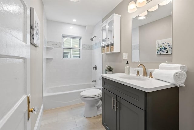 full bathroom with toilet, tiled shower / bath combo, tile patterned floors, and vanity