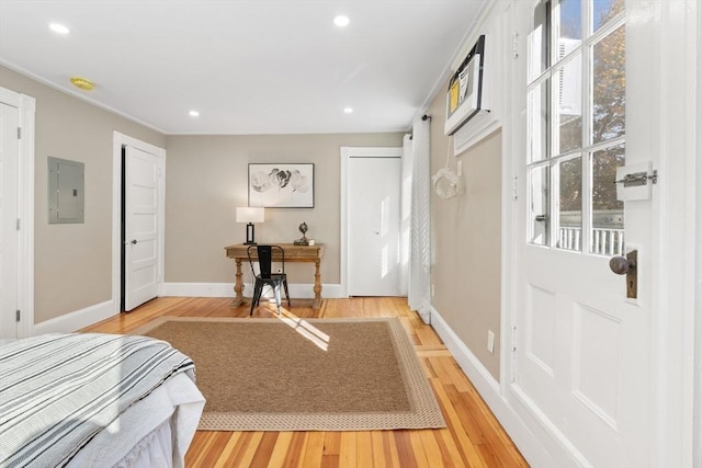 interior space with electric panel and hardwood / wood-style flooring