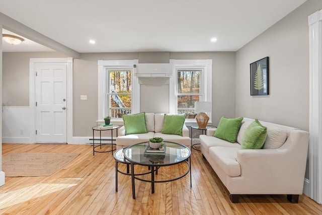 living room featuring light hardwood / wood-style floors and baseboard heating