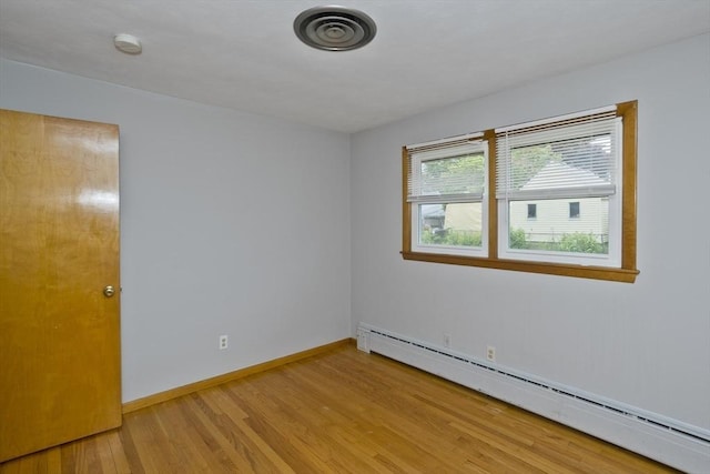 13 Louise Ave, Chicopee, MA 01013 - unfurnished room featuring baseboard heating, light wood-type flooring, and a smoke detector