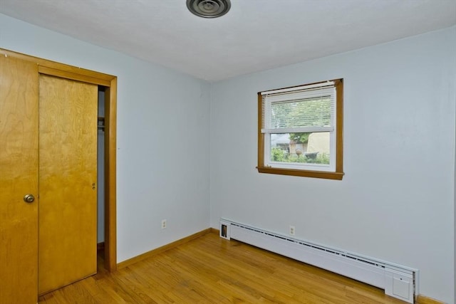 13 Louise Ave, Chicopee, MA 01013 - unfurnished bedroom with a baseboard heating unit and light wood-type flooring