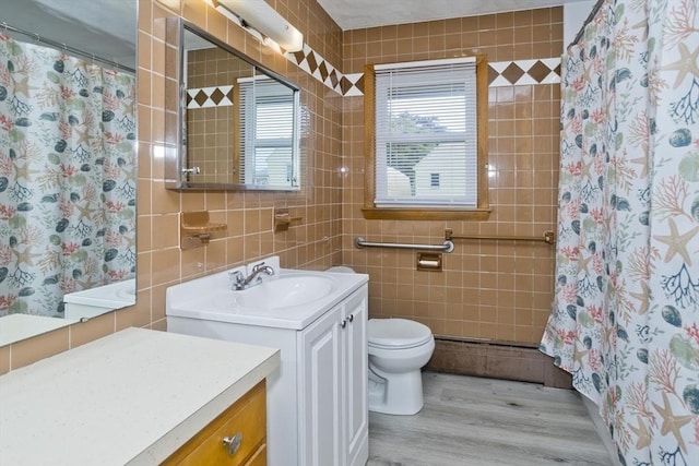 13 Louise Ave, Chicopee, MA 01013 - bathroom with vanity, tile walls, wood finished floors, and a shower with curtain