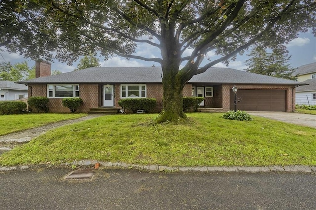 13 Louise Ave, Chicopee, MA 01013 - ranch-style home with brick siding, a garage, driveway, a front yard, and a chimney